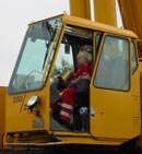 The youngest crane "co-driver" in Denmark supervises the progress.